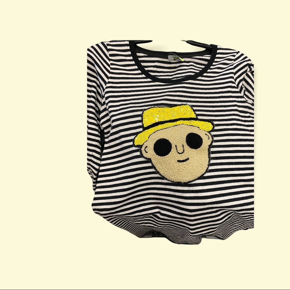 Super fun, spunky black and white striped shirt with face on front